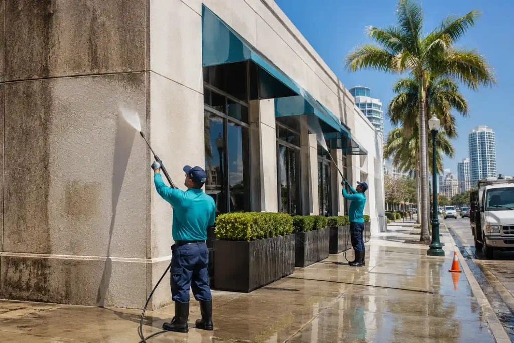 Why Miami Homes and Businesses Should Choose Eco-Friendly Pressure Washing 4 Professional eco-friendly commercial building cleaning crew in Miami FL